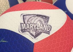Close-up of MVP (Maryland Volleyball Program) branded Mikasa volleyballs — red, white, and blue with the MARYLAND VOLLEYBALL PROGRAM logo.