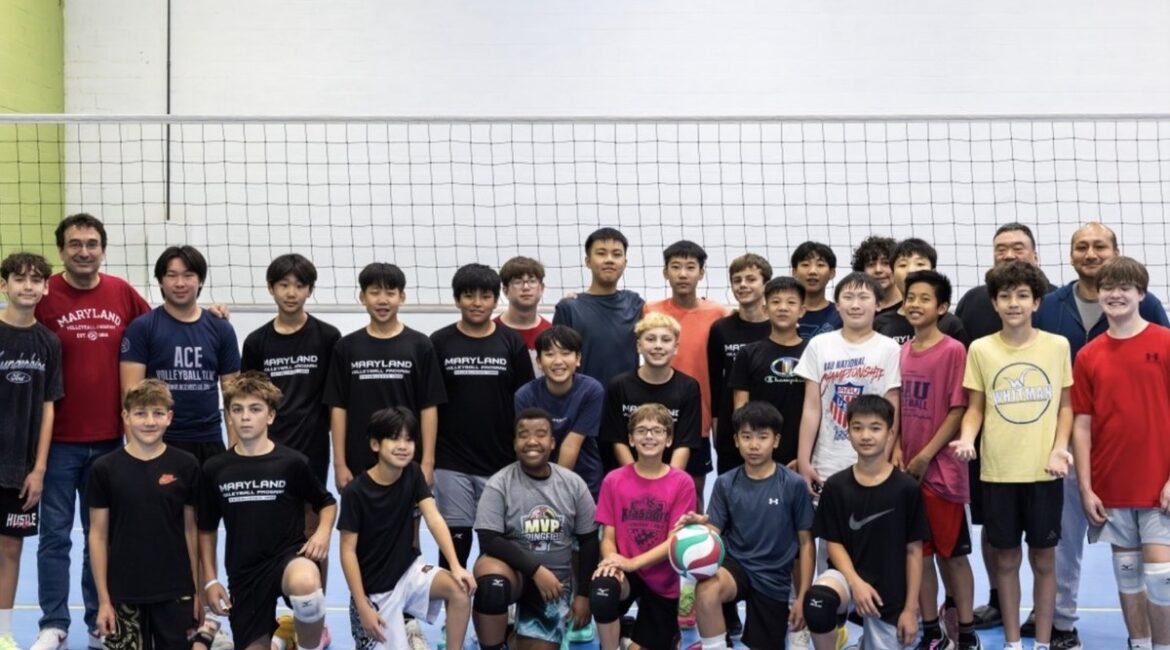 Mixed-age MVP Boys team photo with three coaches at AAU Nationals, showing players of all ages together